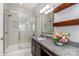 Contemporary bathroom featuring a glass shower and granite countertop at 2153 Darian Way, Waxhaw, NC 28173