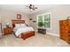 Comfortable bedroom showcasing a bed with wooden headboard, two bedside tables, and a wooden chest at the foot of the bed at 2153 Darian Way, Waxhaw, NC 28173