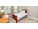 Comfortable bedroom with two windows and a wooden nightstand at 2153 Darian Way, Waxhaw, NC 28173