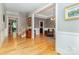 Spacious foyer featuring hardwood floors, elegant trim, and an open staircase, leading into a beautifully designed home at 2153 Darian Way, Waxhaw, NC 28173