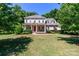 Charming two-story home with a landscaped front yard, inviting porch, and classic architectural details at 2153 Darian Way, Waxhaw, NC 28173
