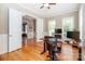 Inviting home office with hardwood floors, natural light, and a spacious desk for productivity at 2153 Darian Way, Waxhaw, NC 28173
