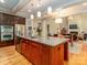 Open concept kitchen with granite countertops, stainless steel appliances, and kitchen island at 2153 Darian Way, Waxhaw, NC 28173