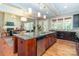 Spacious kitchen with granite counters, a stainless steel dishwasher, and a view into the living room at 2153 Darian Way, Waxhaw, NC 28173