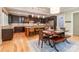 Chef's kitchen with dark cabinetry, stainless steel appliances, and an island with bar seating at 2153 Darian Way, Waxhaw, NC 28173