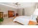 Spacious main bedroom featuring a wooden dresser, a leather chair, and neutral carpet at 2153 Darian Way, Waxhaw, NC 28173