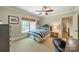 Cozy bedroom with a blue and white striped bed set near natural lighting and neutral decor at 242 Beckham Ct, Charlotte, NC 28211