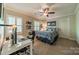 Comfortable bedroom with ceiling fan, desk, and ample natural light perfect for work or relaxation at 242 Beckham Ct, Charlotte, NC 28211