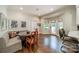 Breakfast area features a built-in bench, a glass table, and access to the backyard at 242 Beckham Ct, Charlotte, NC 28211