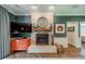 Living room with charming fireplace that includes wooden mantle, with elegant hearth, and cozy ambiance for relaxation at 242 Beckham Ct, Charlotte, NC 28211