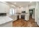 Beautiful kitchen showcasing white cabinets, stainless steel appliances, and granite countertops at 242 Beckham Ct, Charlotte, NC 28211