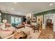 Cozy living room with a brick fireplace, comfortable seating, and access to outdoor spaces at 242 Beckham Ct, Charlotte, NC 28211