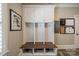Functional mudroom features a bench with cubbies and wall hooks for easy organization at 242 Beckham Ct, Charlotte, NC 28211