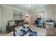 Comfortable office space with modern desk, mini fridge, and cozy seating for work or relaxation at 242 Beckham Ct, Charlotte, NC 28211