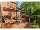 A brick patio complete with an outdoor dining table and lounge furniture at 242 Beckham Ct, Charlotte, NC 28211