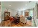 Cozy sitting room with ample natural light, showcasing a blend of classic and contemporary decor, and a relaxing ambiance at 242 Beckham Ct, Charlotte, NC 28211