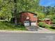 Two-story brick home with attached two-car garage and a well-manicured front yard at 3100 Ventosa Dr, Charlotte, NC 28205