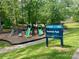 Shamrock Park playground featuring slides, climbing structures, and green space for recreational activities at 3100 Ventosa Dr, Charlotte, NC 28205