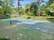 Well-maintained tennis court with green and blue surfaces, complete with nets and fencing at 3100 Ventosa Dr, Charlotte, NC 28205