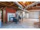 Large basement area with brick accents, exposed beams, and utility hookups, ideal for storage or renovation at 3340 Wrenwood Dr, Newton, NC 28658