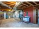 Spacious basement with exposed ductwork, concrete floors, and potential for customization at 3340 Wrenwood Dr, Newton, NC 28658