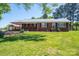 Charming brick home with a well-maintained lawn and inviting front porch at 3340 Wrenwood Dr, Newton, NC 28658