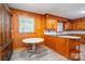 A kitchen with wood cabinets, backsplash, stainless steel appliances, table and light flooring at 3340 Wrenwood Dr, Newton, NC 28658