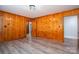 This is a living room that has wood walls, flooring, and a window at 3340 Wrenwood Dr, Newton, NC 28658