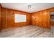 This is a living room that has wood walls, flooring, and a window at 3340 Wrenwood Dr, Newton, NC 28658