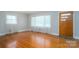 Bright living room with hardwood floors, windows, and a door at 3340 Wrenwood Dr, Newton, NC 28658