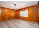 This is a living room that has wood walls, flooring, and a window at 3340 Wrenwood Dr, Newton, NC 28658