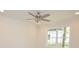 Well-lit bedroom featuring a modern ceiling fan, large window and light vinyl floors at 406 W Marion St, Kershaw, SC 29067