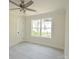 Bedroom with a ceiling fan, large window and light gray vinyl floors at 406 W Marion St, Kershaw, SC 29067