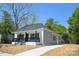 Charming single-story home with a welcoming front porch and newly paved driveway at 406 W Marion St, Kershaw, SC 29067