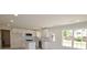 Bright kitchen features modern lighting, granite countertops, stainless appliances, and modern white cabinetry at 406 W Marion St, Kershaw, SC 29067