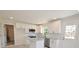 Well-lit kitchen featuring granite countertops, stainless steel appliances and modern white cabinets at 406 W Marion St, Kershaw, SC 29067