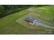Aerial view of home with a long driveway and expansive yard at 485 Hilltop Rd, Oakboro, NC 28129