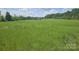 Expansive green lot, providing ample outdoor space and a tranquil setting for this beautiful home at 485 Hilltop Rd, Oakboro, NC 28129