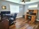 Spacious office featuring a built-in desk and windows providing a naturally lit workspace at 485 Hilltop Rd, Oakboro, NC 28129
