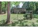 Spacious backyard featuring play set and room to roam at 512 Saint Cloud Dr, Statesville, NC 28625