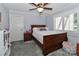 Cozy bedroom with carpet, natural light from the windows, and a ceiling fan at 512 Saint Cloud Dr, Statesville, NC 28625