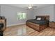 Bedroom with light gray walls, natural light, ceiling fan, and wood floors at 512 Saint Cloud Dr, Statesville, NC 28625