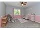 Comfortable bedroom featuring a crib, chair and a window allowing for natural light at 512 Saint Cloud Dr, Statesville, NC 28625