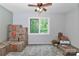 Bright, clean bedroom with a view of trees outside the window and moving boxes inside the room at 512 Saint Cloud Dr, Statesville, NC 28625