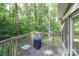 Exterior wood deck showing view of lush greenery and room for outdoor grilling at 512 Saint Cloud Dr, Statesville, NC 28625