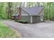 Side view of charming home with two-car garage and tree-lined property at 512 Saint Cloud Dr, Statesville, NC 28625