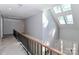 Hallway featuring skylights, railing, and access to multiple rooms at 512 Saint Cloud Dr, Statesville, NC 28625