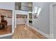 Bright hallway with hardwood floors, second-floor balcony, and easy access to other living areas at 512 Saint Cloud Dr, Statesville, NC 28625