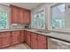 Close up of kitchen with granite countertops, cherry wood cabinets, and stainless steel appliances at 512 Saint Cloud Dr, Statesville, NC 28625