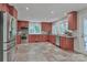 Spacious kitchen featuring stainless steel appliances, granite countertops, and cherry wood cabinetry at 512 Saint Cloud Dr, Statesville, NC 28625